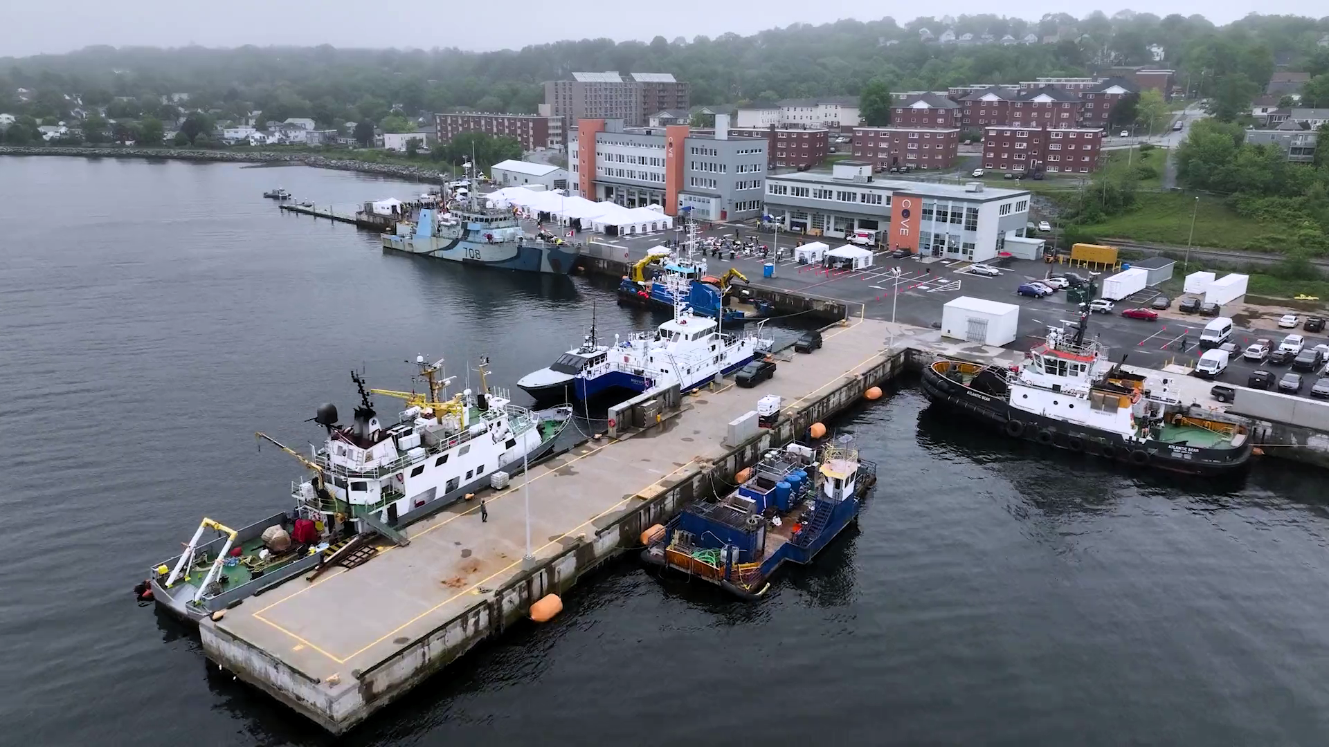 Aerial view of busy piers Dartmouth COVE facility